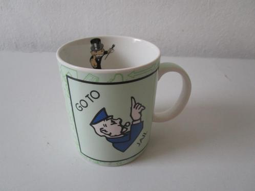 Beker / mok, met opdruk Go to jail, van Monopoly., Huis en Inrichting, Keuken | Servies, Zo goed als nieuw, Kop(pen) en/of Schotel(s)