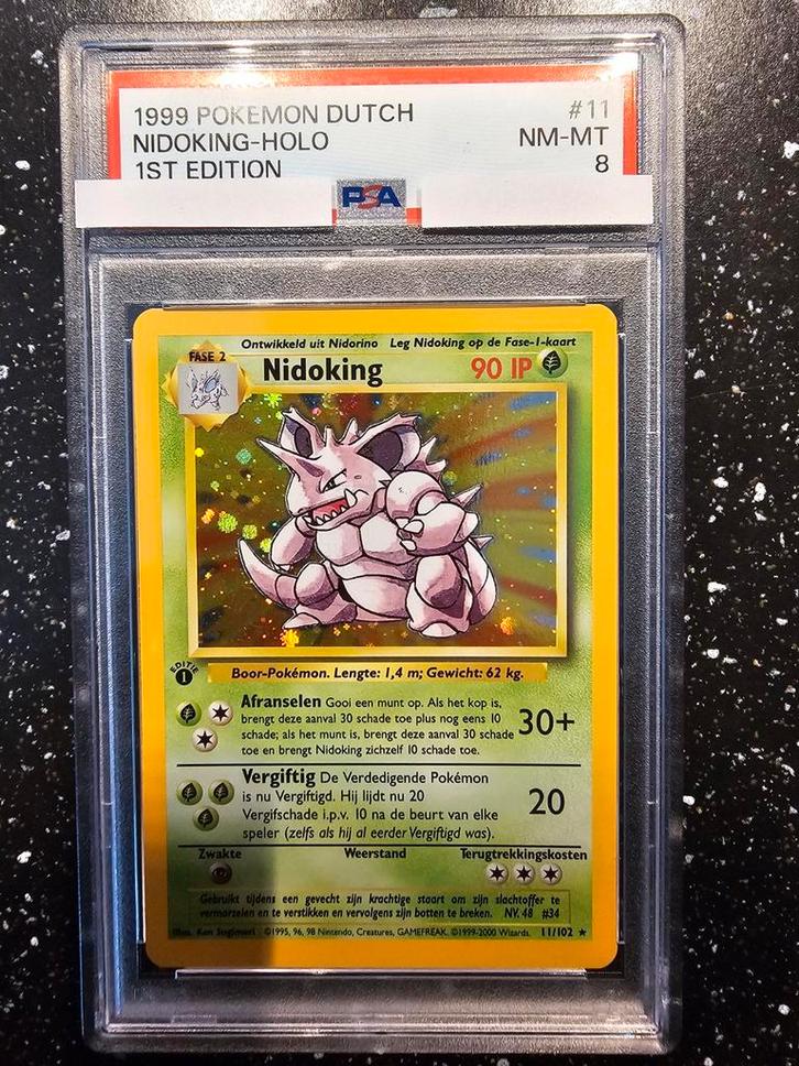 Nidoking Holo 1999 Dutch 1st Ed. PSA 8, Hobby en Vrije tijd, Verzamelkaartspellen | Pokémon, Zo goed als nieuw, Losse kaart, Foil