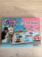 Amika Fotofinish Bordspel - Studio 100, Een of twee spelers, Ophalen of Verzenden, Zo goed als nieuw, Reisspel