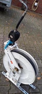 Olieslanghaspel, Ophalen