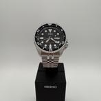 Seiko SKX007 met zwarte wijzerplaat, Staal, Verzenden, Polshorloge, Zo goed als nieuw