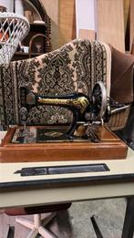 Antieke naaimachine singer, Ophalen