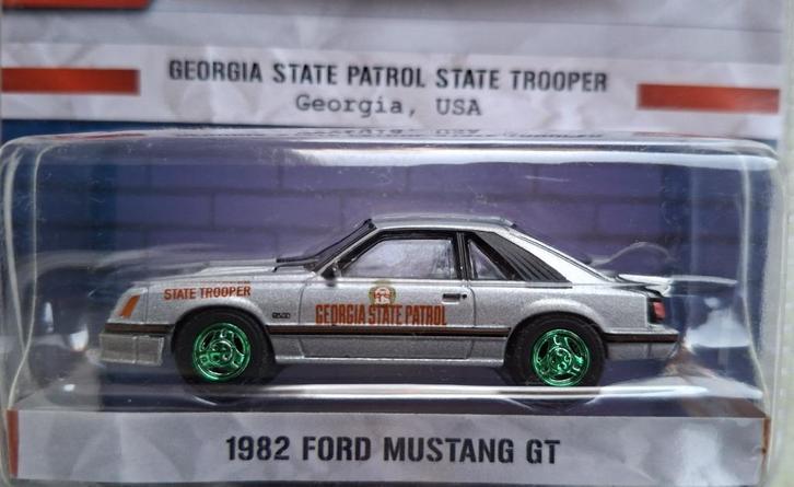1982 Ford Mustang GT van Greenlight 1/64 Chase State Trooper, Hobby en Vrije tijd, Modelauto's | Overige schalen, Nieuw, Auto