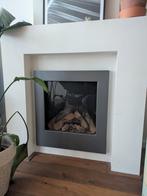 Gebruikte gashaard met keramische houtblokken, Ophalen