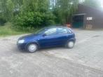 Opel Corsa 1.2-16V Enjoy lage km stand, Voorwielaandrijving, Gebruikt, Zwart, Blauw