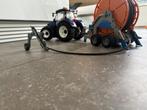 Bruder New Holland met sproeier 03121 02034, Kinderen en Baby's, Speelgoed | Speelgoedvoertuigen, Ophalen, Zo goed als nieuw
