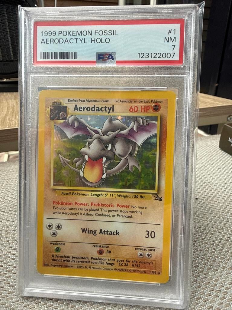 Pokemon Fossil Aerodactyl Holo PSA 7, Ophalen of Verzenden, Zo goed als nieuw, Losse kaart, Foil