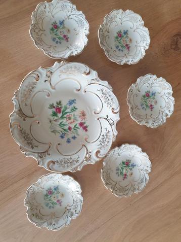 Prachtig Petit foursetje met veldbloemen en sierlijk goud beschikbaar voor biedingen