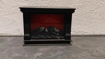 Kleine haard op batterijen beschikbaar voor biedingen