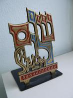 boekensteun uit Israël, brons, Ophalen