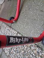 bikelift paddockstand, Ophalen