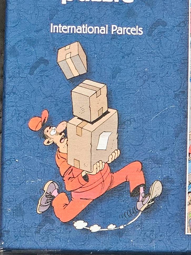 Jan van Haasteren - Internationale Pakketten - 950 stukjes, Hobby en Vrije tijd, Denksport en Puzzels, Zo goed als nieuw, Legpuzzel