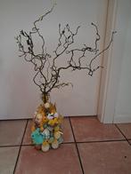 Fles met paasversiering en takken, Ophalen