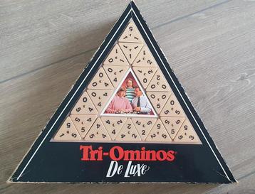 Triominos spel niet helemaal compleet 2 andere stenen erbij  beschikbaar voor biedingen