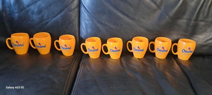 Te koop 8 chocomel bekers nieuw in doos, Huis en Inrichting, Keuken | Servies, Nieuw, Kop(pen) en/of Schotel(s), Overige stijlen