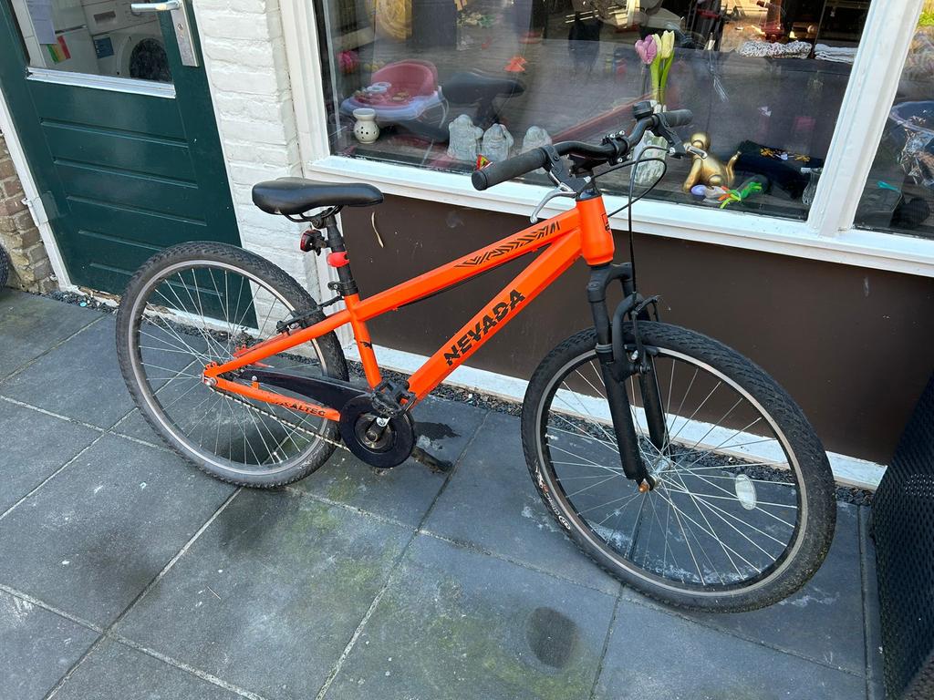 Nevada mountainbike oranje 26 inch, Ophalen, Gebruikt, 26 inch of meer, Handrem