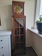 Eiken staande klok met koperen gewichten, Ophalen