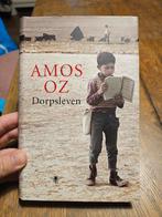 Amos Oz - Dorpsleven, Boeken, Amos Oz, Ophalen of Verzenden, Zo goed als nieuw