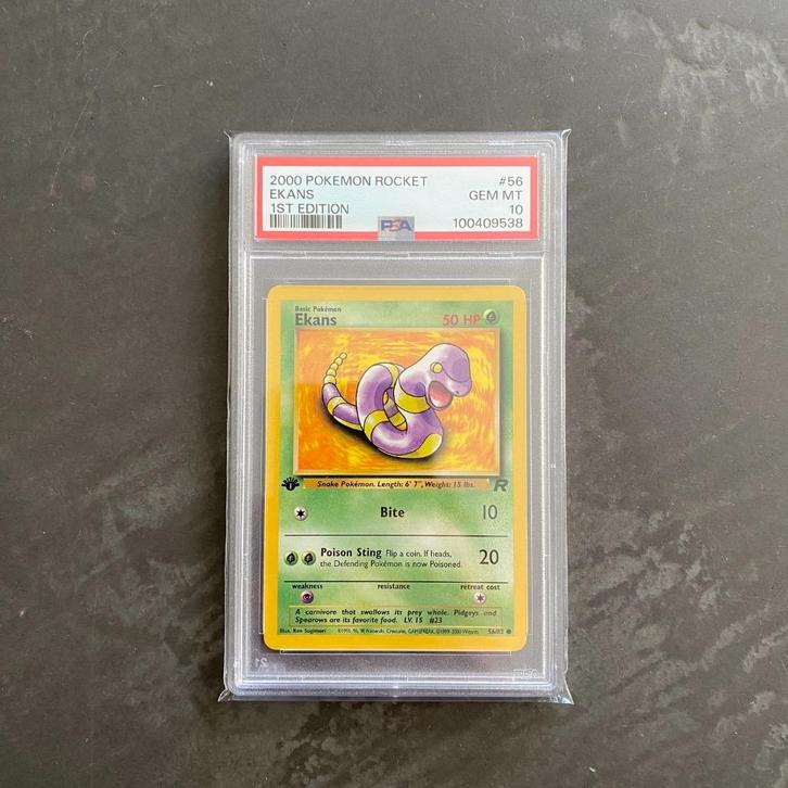Pokémon Rocket #56 Ekans 1st Edition PSA 10, Hobby en Vrije tijd, Verzamelkaartspellen | Pokémon, Zo goed als nieuw, Ophalen of Verzenden