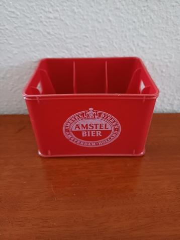 Klein bierkrat Amstel beschikbaar voor biedingen