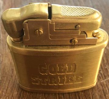 Vintage Gold Strike Aansteker collectorsitem beschikbaar voor biedingen