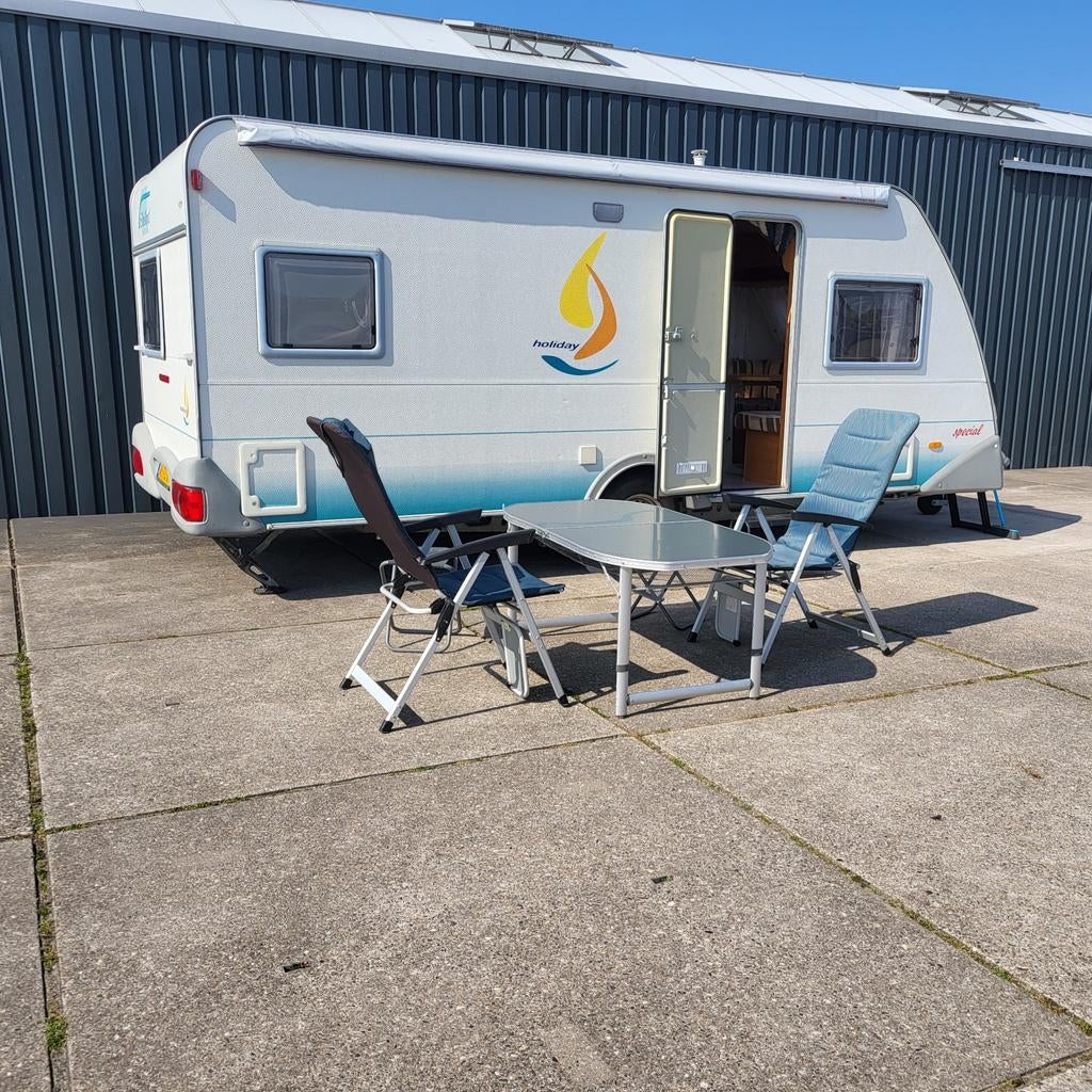 Te koop Eifelland Holiday E500! Met vele extra's, Rondzit, Frans bed, Airco, 4 tot 5 meter