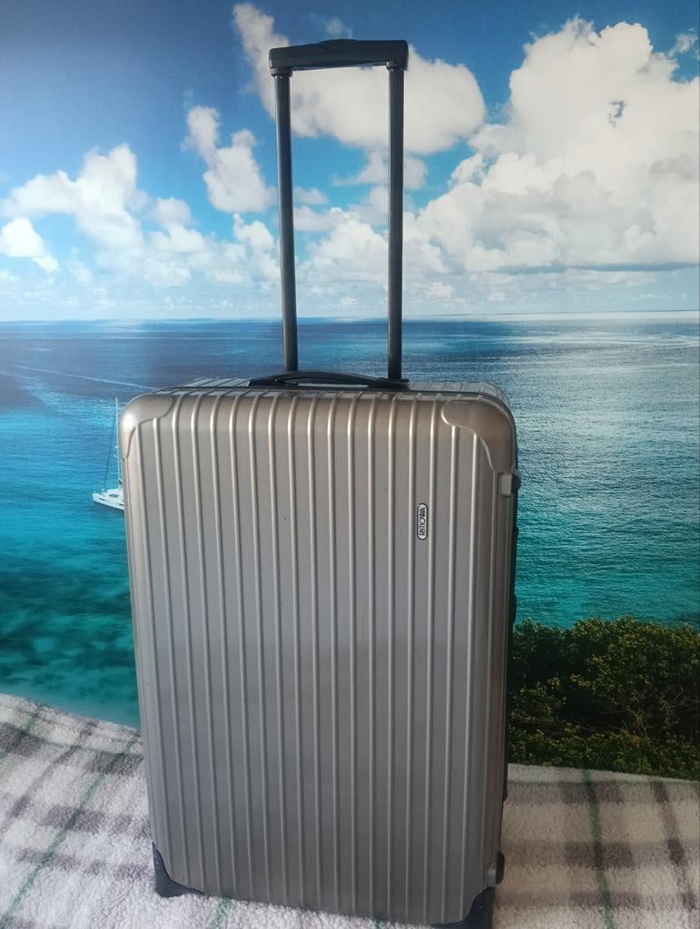 Rimowa trolley koffers spinners, Ophalen, Slot