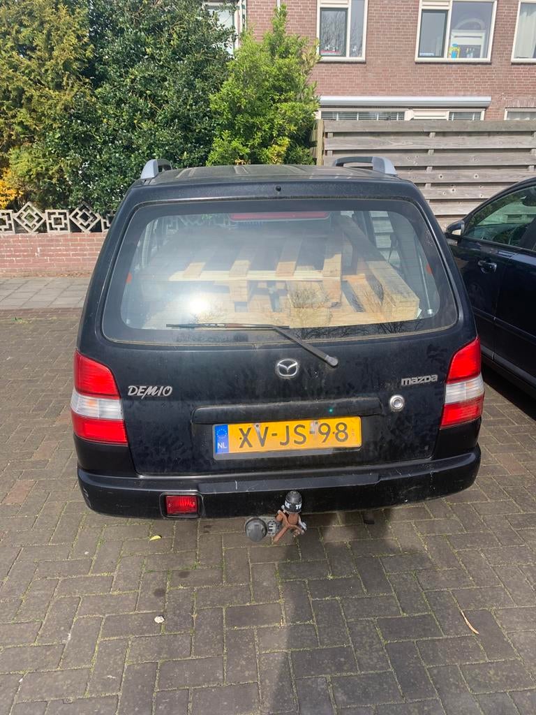 Mazda Demio 1.3 Comfort 1999 Zwart, Auto's, Mazda, 31 €/maand, Zwart, Particulier, 1324 cc