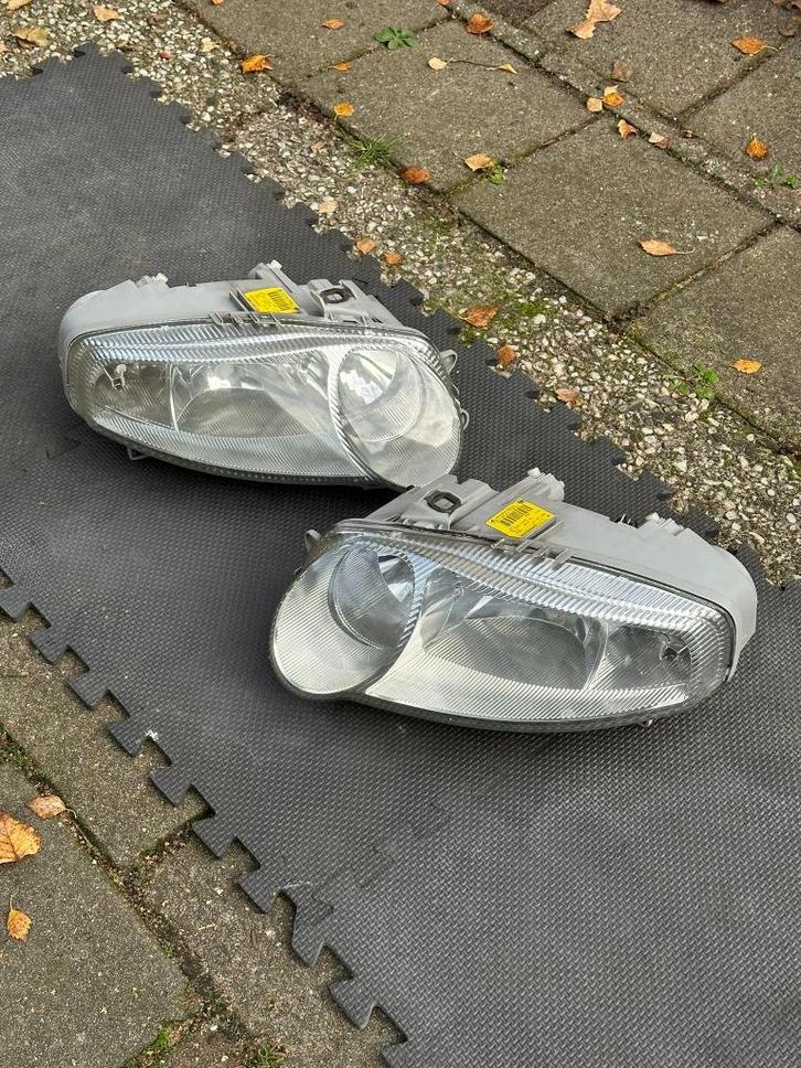 Koplampen origineel pre-facelift Alfa Romeo 147, Auto-onderdelen, Verlichting, Alfa Romeo, Nieuw, Ophalen of Verzenden