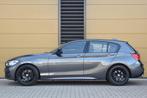 BMW 1-serie 120i High Executive * M Sportpakket * Navigatie, Te koop, Zilver of Grijs, 1355 kg, Benzine