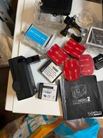 Gopro Hero 2 accessoires en twee accu’s met lader…, Ophalen of Verzenden, Zo goed als nieuw, GoPro