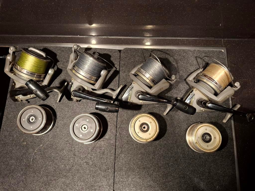 Vier Shimano Titanos XT 10000 werpmolens met extra spoelen, Ophalen, Gebruikt, Molen