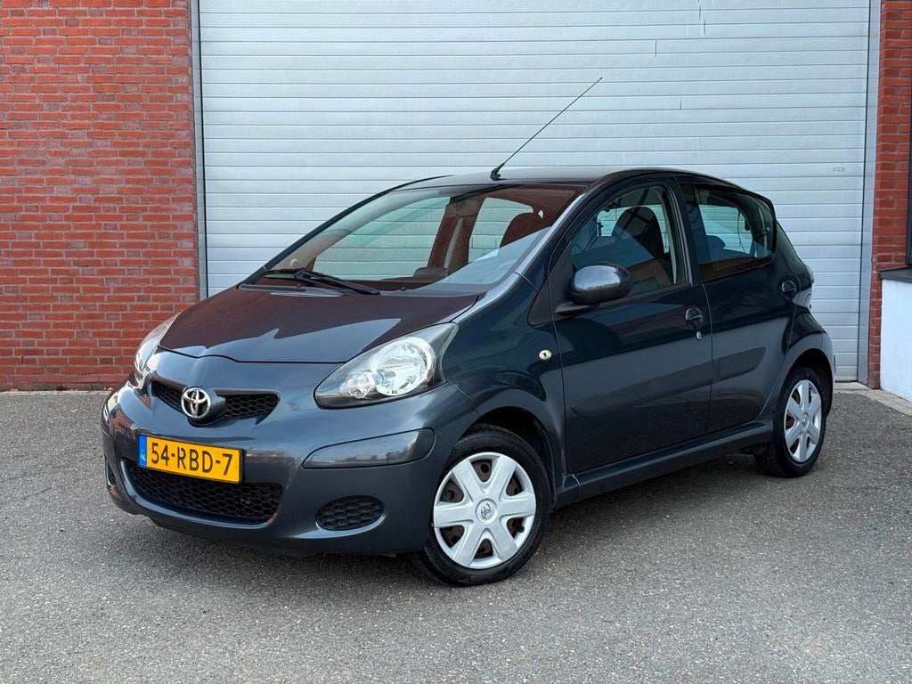 Toyota Aygo 1.0-12V Comfort Navigator| NAP| AIRCO| AUTOMAAT, Euro 5, Stof, Zwart, 4 stoelen