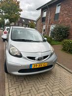 Toyota Aygo 1.0 12V Vvt-i 5DRS 2007 Grijs, Auto's, Voorwielaandrijving, 4 stoelen, 68 pk, Origineel Nederlands