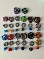 Te koop: Beyblades nieuw en oud met 2 arena's, Ophalen of Verzenden, Gebruikt