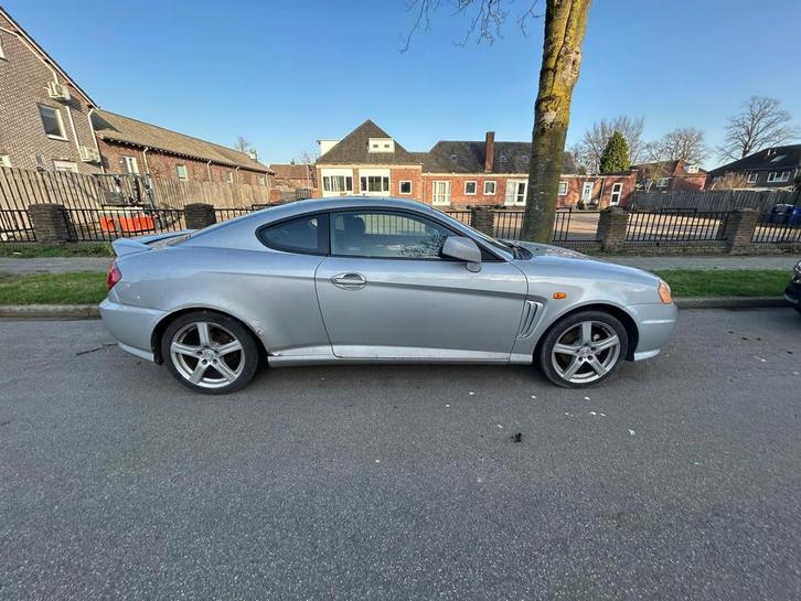 Hyundai Coupé 2.0 2002 Grijs, Auto's, Hyundai, Particulier, Coupé, Airconditioning, Elektrische ramen, Benzine, D, Coupé, Handgeschakeld