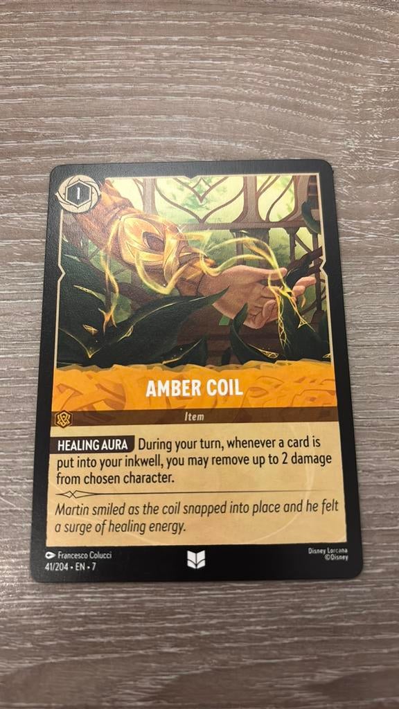 Disney Lorcana Amber Coil 41-204 7ARI nonfoil, Ophalen of Verzenden, Zo goed als nieuw, Losse kaart