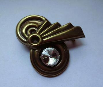 Bronskleurig broche grote glimmer met soort krul beschikbaar voor biedingen
