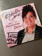 Priscilla Ophof - De Allergrootste Glimlach (Gesigneerd), Ophalen of Verzenden, Zo goed als nieuw, Levenslied of Smartlap