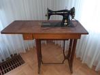 naaimachine Singer in tafel, Ophalen