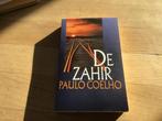 De ZAHIR……..Paulo Coelho…….Wat een vraag roep dit op, Ophalen of Verzenden, Zo goed als nieuw