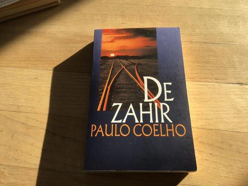 De ZAHIR……..Paulo Coelho…….Wat een vraag roep dit op, Boeken, Romans, Zo goed als nieuw, Ophalen of Verzenden