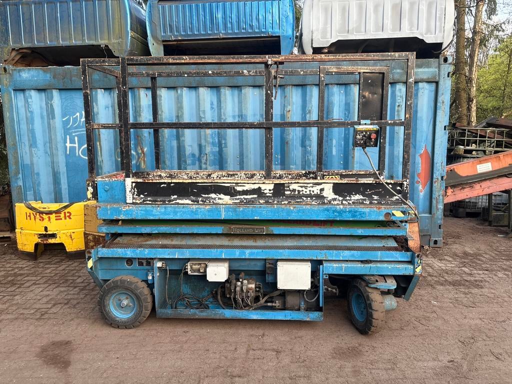 Hoogwerker. Schaar hoogwerker. Holland lift, Ophalen, Gebruikt, IJzer