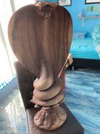 Houten cobra, Ophalen