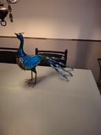 Metalen pauw, Ophalen