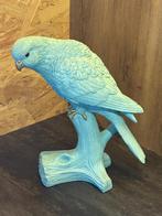 Turquoise beeld van een papegaai, Ophalen