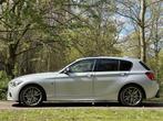 BMW 1 Serie M135i High Executive Schuifd. HK € 20.900,00, Auto's, Nieuw, Zilver of Grijs, Geïmporteerd, 5 stoelen