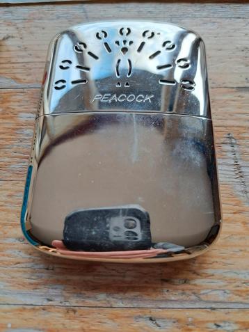 Originele Peacock Zakverwarmer beschikbaar voor biedingen