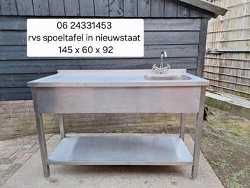 In topstaat verkerende rvs spoeltafel met kraan  beschikbaar voor biedingen