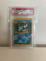 PSA 9 1st edition Holo Vaporeon Jungle 12/64, Ophalen of Verzenden, Zo goed als nieuw